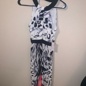 Black and white maxi dress with flower at bottom